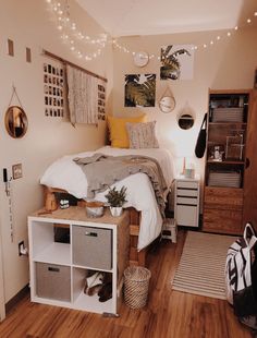 a bed room with a neatly made bed and lots of decorations on the wall above it