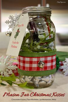 a mason jar filled with christmas kisses