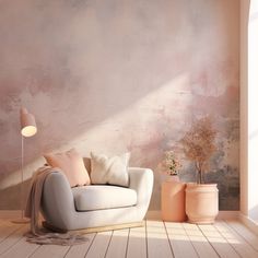 a living room with a couch, lamp and potted plants on the floor in front of a pink wall