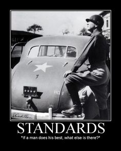 a man sitting on top of an old car