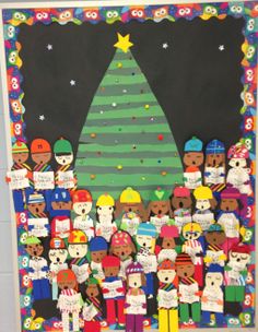 a bulletin board decorated with people and a christmas tree