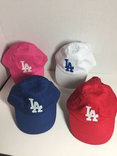 This hat is for your favorite little LA Dodgers fan. Baseball hat style Measures approx. 18" around  100% Cotton Elastic Back Red Baseball Cap As Gift, Red Baseball Cap Gift, Red Baseball Cap For Gift, Playful Adjustable Red Hat, White Bucket Hat For Play, Playful Baseball Cap For Play, Adjustable Baseball Cap For Play, Personalized Adjustable Blue Baseball Cap, Personalized Blue Hat With Curved Brim