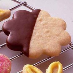 several cookies and pastries on a cooling rack