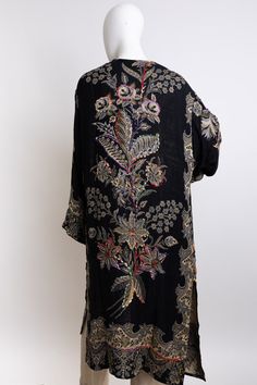 Float gracefully in the Ethereal Effie Embroidered Kimono. Adorned with delicate embroidery, this kimono will make you feel like a goddess. Perfect for adding a touch of elegance to any outfit, it's a must-have for a fun and happy wardrobe. #lovemyleto Festive Kaftan With Floral Embroidery And Kimono Sleeves, Elegant Embroidered Silk Kimono, Elegant Black Embroidered Kimono, Bohemian Long Kimono With Intricate Embroidery, Elegant Long Embroidered Kimono, Embroidered Silk Kaftan With Kimono Sleeves, Silk Embroidered Kaftan With Kimono Sleeves, Silk Kimono With Floral Embroidery, Elegant Black Kimono With Floral Embroidery