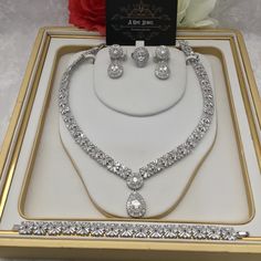 Sparkle and shine like never before with the range of cz diamond cubic zirconia silver plated bridal necklace set with matching earrings. This beautiful cubic zirconia encrusted necklace set is the perfect accessory  for your wedding day. Beautiful elegant, this silver cubic zirconia necklace set is filled with the dazzling sparkle. Guaranteed to transform your look in seconds to gain instant luxury, this stunning necklace set will ensure you steal every spotlight. Bring the dazzle into your out Cubic Zirconia Jewelry Sets For Anniversary, Cubic Zirconia Bridal Necklace For Anniversary, Cubic Zirconia Bridal Sets With Diamond Cut As Gift, Anniversary Jewelry Sets With Cubic Zirconia Round Cut, Silver Diamond Cut Jewelry Sets For Anniversary, Silver Round Cut Jewelry Set For Formal Occasions, Brilliant Cut Cubic Zirconia Jewelry Sets For Anniversary, Fine Jewelry Set With Sparkling Stones For Anniversary, Diamond White Cubic Zirconia Jewelry Sets With Diamond Cut