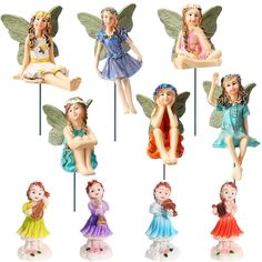 six fairy figurines sitting on top of each other