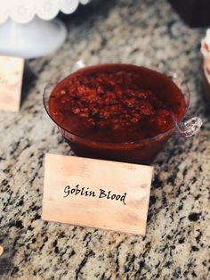 a bowl of food sitting on top of a counter next to a sign that says goffin blood