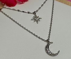 This a lovely necklace in 925 sterling silver double layer chain with a Moon and star shiny  pendant hand crafted by us. Ideal as gift or for your fashion.  The chain are about 18" and 16" and the pendant are about 10 mm   925 hallmark tag. It comes in a gift package. We aim to dispatch our orders in 24 hours using free 48 hours delivery but if you need your item quicker there is an option on the checkout for next day delivery for only £ 3.50. Silver Celestial Necklace For Her, Silver Star-shaped Jewelry With Delicate Chain, Silver Double Strand Jewelry As A Gift, Celestial Silver Charm Necklaces With Delicate Chain, Celestial Silver Charm Necklace With Delicate Chain, Silver Delicate Chain Celestial Necklace, Silver Celestial Necklace With Delicate Chain, Celestial Silver Necklace With Delicate Chain, Layer Chain