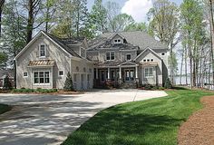 a large house with lots of windows in the front yard