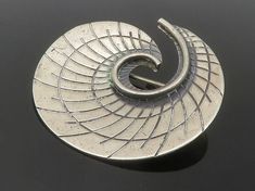 "BEAU 925 Sterling Silver - Vintage Etched Detail Spiral Brooch Pin - BP5606  BEAU 925 Sterling Silver - Vintage Etched Detail Spiral Brooch Pin - BP5606  Jewelry Type:         Brooch Pin   Metal Type:            925 Silver  Metal Size:             1.5\"  Stone Type:            N/A  Condition:              N/A  Jewelry Weight:     8 Grams  PLEASE NOTE: THIS ITEM IS PRE-OWNED. ALTHOUGH MOST ITEMS ARE IN VERY GOOD CONDITION, SOME MAY NEED CLEANING AND/OR MINOR REPAIRS. WE MAKE A VERY STRONG EFFORT TO UPLOAD CLEAR PICTURES. PLEASE INSPECT ALL PICTURES AND ASK ALL QUESTIONS YOU MAY HAVE PRIOR TO MAKING A PURCHASE. NOT ALL STONES ARE GENUINE, SOME ARE ENHANCED OR CREATED." Antique Rings, Etching, Beautiful Necklaces, Types Of Metal, Brooch Pin, Brooches, Metallic Silver, Sell On Etsy, 925 Silver