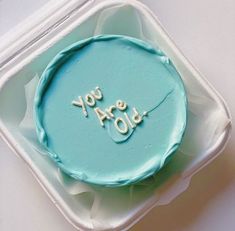 a cake with the words you are old written on it in frosting and icing