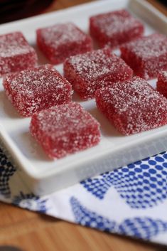 some sugar cubes are on a white plate