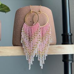 Pink and Gold Ombre Beaded Fringe Earrings | Handmade Beaded Earrings | Hand Crafted Boho Earrings | Statement Jewelry | Unique Gift for Her Welcome to our exquisite collection of handmade beaded earrings that will elevate your style to new heights. Each pair is meticulously crafted with love and attention to detail, resulting in stunning accessories that are perfect for any occasion. Product Details: Length: 4 inches Material: High-quality glass seed beads, Gold plated ear wires and circular ri Beaded Chain Earrings As Gift, Beaded Chain Earrings With Round Beads For Gifts, Pink Round Beaded Earrings With Dangling Beads, Gift Gold Beaded Earrings, Pink Beaded Chain Dangle Earrings, Pink Beaded Earrings With Gold Beads As Gift, Pink Earrings With Gold Beads, Faceted Beads Chandelier Earrings For Gift, Gift Faceted Beads Chandelier Earrings