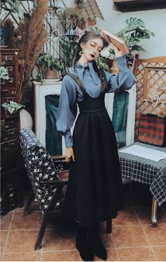 2-Piece Dark Witchy Academia Dress Set featuring pinafore dress in charcoal and a long puff sleeve shirt with a pointed collar in cold blue. Dress Size S Waist 68cm Length 117cm Size M Waist 72cm Length 117cm Size L Waist 76cm Length 110cm Size XL Waist 80cm Length 117cm Shirt - One Size Bust 98cm Length 62cm Witchy Dark Academia Aesthetic Outfit, Formal Pinafore Dress, Dark Witch Academia Outfit, Overall Dress Long, Witchy Librarian Aesthetic, Pinafores For Women, Dark Academia Fancy Outfit, Dark Outfits Casual, Blue Witchy Outfit