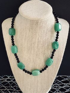 "Aventurine Nugget and Onyx Beaded Necklace, Choker, Collar Necklace, Gemstone Necklace, Women's Handmade Jewelry. Color is Green and Black. Materials are Aventurine, Onyx, and Stainless steel. Necklace has a stainless steel lobster claw closure. * Green Aventurine is known as the \"Stone of Opportunity,\" thought to be the luckiest of all crystals, especially in manifesting prosperity and wealth, or for increasing favor in competitions or games of chance. Its winning energy makes it a great all Onyx Gemstone Beaded Necklaces For Gifts, Onyx Gemstone Beaded Necklaces As Gift, Healing Onyx Beaded Necklaces With Black Beads, Onyx Gemstone Beaded Necklace For Gift, Onyx Gemstone Beaded Necklace As A Gift, Healing Onyx Beaded Necklace With Black Beads, Onyx Necklace With Black Beads For Healing, Healing Onyx Beaded Necklace, Black Jade Round Beads Jewelry