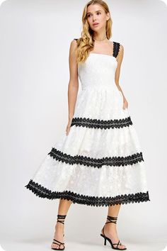 Lace trimmed long dress in embroidered eyelet lace fabric. This style features a smocked fitted bodice, contrast color scallop lace trim at skirt/straps, side pockets and adjustable straps. -lined -lightweight Fabric Contents - 100% polyester -Hand wash, dry flat -Colors may vary from different viewing devices. Spring Cotton Dress With Scalloped Lace, Spring Dress With Lace Trim And Tiered Skirt, Summer Cotton Dress With Scalloped Lace, Summer Cotton Dresses With Scalloped Lace, Summer Tiered Dress With Scalloped Lace, Tiered Lace Trim Dress For Garden Party, Summer Midi Dress With Scalloped Lace For Daywear, Lace Trim Tiered Skirt Dresses For Garden Party, Spring Lace Dress With Square Neck And Ruffles