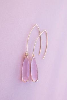 Pink Pendant Earrings ⟡ all items are designed and handcrafted in our studio ⟡ Long pink glass and gold teardrop earrings. These drool-worthy teardrop earrings boast a dreamy pink glass stone set in a glamorous gold-plated brass setting, making any outfit look luxe in an instant. The long wire creates a dramatic yet effortless look that you can wear anywhere. Don't let this must-have accessory slip away!OVERVIEW-3" in length-glass crystals-gold plated over stainless steel ear wiresLooking for mo Elegant Pink Long Drop Earrings, Dainty Pink Earrings For Party, 14k Gold Filled Elegant Teardrop Earrings, Elegant 14k Gold-filled Teardrop Earrings, Dainty Pink Party Earrings, Pink Briolette Earrings For Gift, Pink Briolette Earrings As Gift, Feminine Teardrop Earrings For Party, Pink 14k Gold Filled Dangle Jewelry