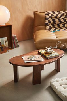 Create a contemporary gallery in your space with our Organic Shaped Coffee Table. Crafted from mango wood, this coffee table features a puddle-shaped tabletop with sleek block legs. Made from natural materials, each coffee table is one-of-a-kind with a unique finish that has natural variance from piece to piece. Available exclusively at Urban Outfitters. Features Organic Shaped Coffee Table from UO Home Crafted from mango wood with statement finishes Puddle-shaped tabletop & block legs One-of-a-kind, each coffee table has natural wood variance Some assembly required UO exclusive Content + Care Assembly required - Assembly instructions and hardware included Mango wood Wipe clean Please note, this is a solid wood item may naturally expand and contract with seasonal changes in humidity. Impor Coffee Table Urban Outfitters, Room Wall Decoration Ideas, Organic Coffee Table, Living Room Wall Decoration, Modern Living Room Wall, Wall Decoration Ideas, Room Wall Decoration, Uo Home, Mid Century Modern Coffee Table