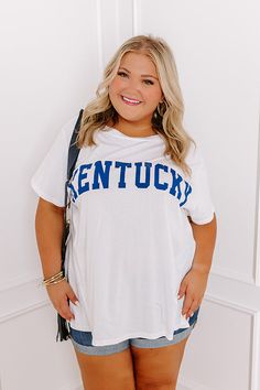 - Let your love for the Bluegrass State shine with this soft tee! Its breathable 100% cotton material makes it perfect for anything from a morning run to a spirited tailgate party. - Unlined cotton material - 'KENTUCKY' lettering across the front - A crew cut neckline - Short sleeves - A relaxed silhouette that ends in a straight hemline White T-shirt For Summer Fan Gear, Summer Sports Fan Cotton T-shirt, Summer Cotton Sports Fan T-shirt, Cotton Sports Fan T-shirt For Summer, White Casual Top For Tailgating, Casual White Top For Tailgating, Morning Run, Denim Sneakers, Crew Cut