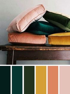 pillows and cushions on top of a wooden bench with color swatches in the background