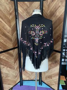 "1970's does 1920's black shawl with fringe and colorful embroidery. Very lightweight, excellent vintage condition.  66\" length 29\" tall (excluding fringe" Black Folk Style Shawl For Festival, One Size Black Scarves For Spring, Black Bohemian Dupatta For Festival, Embroidered Black Shawl For Fall, Black Embroidered Shawl For Fall, Black Bohemian Shawl For Fall, Black One Size Scarves For Spring, Black Bohemian Shawl For Spring, Traditional Black Shawl One Size