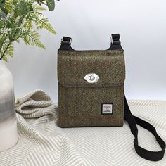 This Genuine Harris Tweed Satchel Bag is stylish, elegant and one of our best sellers . In Country Green, it's finished in our trademark Harris Tweed. This medium crossbody bag would make an excellent birthday gift.  The lightweight bag benefits from inside pockets as well as an open pocket on the front and a zip pocket on the reverse. Visit our Etsy store to view this cross shoulder bag in other colours, and to find matching accessories.  Cross Shoulder Bag Dimensions: 25cm x 22cm x 6cm Maccess Cross Shoulder Bag, Medium Crossbody Bag, Cross Shoulder Bags, Lightweight Bag, Scottish Heritage, News Boy Hat, Matching Accessories, Harris Tweed, Satchel Purse