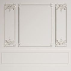 an empty room with white walls and decorative moldings