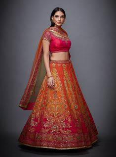 Editor's Note This set features a fuchsia & orange embroidered ombre lehenga with blouse & dupatta. Sleeve Type: Cap Sleeves Neck: Round Neck Fabric: Silk Chinon Care: Dry Clean Only About the DesignerRi Ritu Kumar is one of India’s foremost designers. She has developed a unique style of her own, reflecting the ancient traditions of Indian craftsmanship in a contemporary vocabulary. With a background in art history and museology, which has enriched her horizons, Ritu’s understanding of ancient d Festive Multicolor Embroidered Lehenga With Sheer Dupatta, Orange Designer Choli With Dori Work, Designer Orange Choli With Dori Work, Festive Choli With Multicolor Embroidery And Sheer Dupatta, Festive Multicolor Embroidered Choli With Sheer Dupatta, Orange Bollywood Set With Sheer Dupatta, Designer Orange Choli With Sheer Dupatta, Orange Embroidered Choli For Reception, Embroidered Orange Choli For Reception