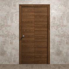 an empty room with a wooden door on the wall and wood flooring in front of it