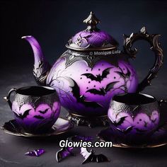 a purple tea set with bats painted on it