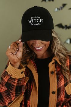 Embrace your inner witchy vibes with our "Baddest Witch Ball Cap" in bold black. This cap adds a touch of attitude and style to your look, perfect for showcasing your unique personality. Black ball cap "Baddest Witch In Town" Cap Design Ideas, Horror Fashion, Witch Ball, Style Wide Leg Jeans, Bride Top, Fashion Goth, 90's Grunge, Black Gifts, Vinyl Shirts