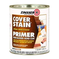 a can of primer paint on a white background with the words cover stain in it