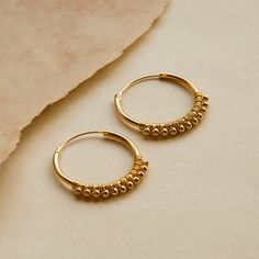 A simple, intricate design for an everyday summer wear. Or why not gift a bestie with a sweet little treat. The Ball detail Hoops are light enough that you won't even realise you are wearing them! All of our jewellery comes in a gift box with a blank gift card for you to write a short message on Made from: Gold plated Sterling silver Dimensions: 25mm in length and across. Minimalist Hypoallergenic Hoop Earrings For Summer, Summer Minimalist Hypoallergenic Hoop Earrings, Nickel Free Minimalist Hoop Earrings For Summer, Hypoallergenic Small Hoop Earrings For Summer, Hypoallergenic Hoop Earrings As Summer Gift, Handmade Hoop Earrings For Everyday Summer Wear, Knot Studs, Short Message, Climber Earrings