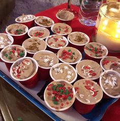 cupcakes with frosting and sprinkles are arranged on a tray