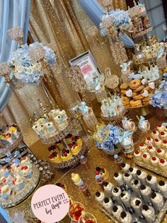 a table filled with lots of desserts and pastries on top of each other