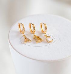 NOTE: the hoop earrings in picture are NOT included in this item. Size: 10.5mm / loop size 1mm approx. Material: 18K real gold plated on brass, cubic zirconia Quantity: 1 piece, you choose letter Feel free to contact me if you want bulk quantity, I can make a custom listing for you. Personalized Gold Huggie Jewelry, Gold Initials Earrings, Gold Round Initials Earrings, Gold Round Earrings With Initials, Alphabet Beads, Letter Charm, English Letter, Letter Charms, Real Gold