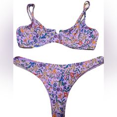 B Swim Aruba Top In Beachfront Bloom Print. Size Medium. Stock Photo To Show Style And Color And Fit. Last Few Personal Gallery Pics Are Of Actually Swim Suit. This Bombshell Bra Will Flatter Any Shape And Provide Just The Right Amount Of Support. Adjustable Straps And Underwire Make The Aruba Top Just As Comfortable As It Is Cute And Classy. Underwire Adjustable Straps Hook Closure At Back Bottom Is The Havana Bottom. Also Medium. Color Is Beachfront Bloom. Pics To Show Style And Fit. The Havan Purple Swimwear For Sunbathing During Beach Season, Purple Triangle Top Swimwear For Beachwear, Fitted Purple Swimwear For Vacation, Purple Beachy Swimwear For Spring, Purple Beachwear Swimwear For Poolside, Purple Swimwear For Spring Poolside, Purple Swimwear For Poolside In Spring, Purple Swimwear For Sunbathing In Summer, Purple Swimwear For Spring