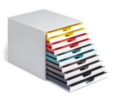 a stack of different colored folders sitting next to each other on a white surface