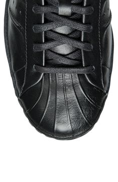 A monochromatic upper with decorative stitching adds a clean, sporty vibe to a low-profile leather sneaker set on a rubber cupsole. Lace-up style Removable insole Leather upper/textile lining/rubber sole Imported Black Sneakers With Stitched Sole For Sports, Black Sports Sneakers With Stitched Sole, Sporty Black High-top Sneakers With Stitched Sole, Decorative Stitching, Sneaker Men, Up Styles, Leather Sneakers, Low Profile, Rubber Sole