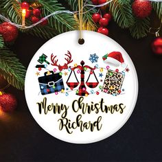 a merry christmas ornament hanging from a tree