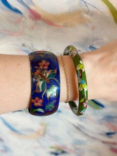 You are enchanted by life and embrace all of your supernatural leanings. You are drawn to the wonder in this 1960's cloisonné and enamel bangle. An heirloom full of wonder to pass down your magic for many generations to come. “I LOVE IT WITH MY WHOLE HEART” GUARANTEE: In our jewelry, we use 14k gold filled, sterling silver, and solid brass as well as vintage components that have stood the test of time! These antique components are of high quality and have lasted for many decades - many even centuries! You can trust that if it still looks good today, it will stand the test of time as a part of your wardrobe too! Enamel Bracelet Bangle, Vintage Enamel Bangle As A Gift, Traditional Handmade Enamel Bangle, Bohemian Enamel Bangle Bracelet, Vintage Enamel Bangle Jewelry, Big Statement Earrings, Glam Earrings, Unique Bridal Jewelry, Costume Rings