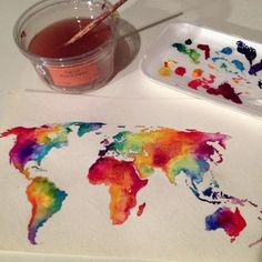 watercolors are being used to paint the map of the world