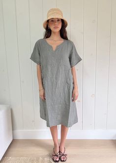 This timeless classic dress features 100% Linen, an airy and lightweight fabric, with side pockets for added convenience. Its classic color and effortless elegance provides an all-day comfort look. Wearable in any season, this must-have item is sure to become a wardrobe staple. Color: khaki. 100% linen Care instructions: hand wash and hang to dry. Made in Italy. V-neck Linen Dress For Workwear With Relaxed Fit, Relaxed Fit Linen V-neck Dress For Work, Casual Solid Linen Dress For Daywear, Casual Linen Shift Midi Dress, Casual Dresses With Pockets And Relaxed Fit, Casual Unlined Linen Dress For Daywear, Daywear Shift Midi Dress With Pockets, Casual Linen Plain Dress, Casual Linen Midi Dress With Relaxed Fit