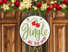 a sign that says jungle all the way hanging from a door with christmas decorations around it