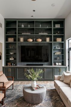 a living room filled with furniture and a flat screen tv