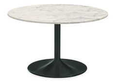 a white marble table with black metal base and round top, viewed from the front