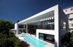 four different shots of a house with swimming pool