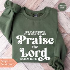 All of our Praise The Lord hoodies are handmade to order on an ultra soft crewneck that will quickly become your go to apparel item! You will never want to take it off! Our Christian sweatshirts are handmade to order with eco-friendly water based ink that feels good and lasts longer! ♥The details♥ This unisex sweatshirt is crafted from soft, breathable fabric for ultimate comfort. Printed with an eco-friendly water-based ink, this sweater not only looks great but also supports sustainable practices. The unisex sizing allows for a versatile fit, but we suggest sizing up for a more relaxed look. To keep your crewneck looking its best, we recommend washing it on cold and either hanging it to dry or tumble drying it on low heat. Be sure to avoid ironing directly on the design to preserve the v Green Pre-shrunk Relaxed Fit Sweatshirt, Green Relaxed Fit Pre-shrunk Sweatshirt, Inspirational Cotton Crew Neck Sweatshirt, Green Pre-shrunk Hoodie With Crew Neck, Green Pre-shrunk Crew Neck Hoodie, Inspirational Cotton Crew Neck Hoodie, Green Crew Neck Sweatshirt With Lettering, Green Long Sleeve Sweatshirt With Lettering, Christian Sweater