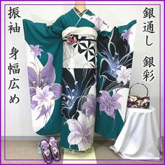 This furisode (long-sleeved kimono) has large lilies dyed on a green and off-white background with silver threads woven into the fabric. It is decorated with silver threads and point embroidery. The fashionable colors and silver threads on the ground are not too simple and modern, making it a very popular item. Sleeve length: 72.5 cm Length (from the shoulder): 168.5cm Sleeve width: 36.3cm Sleeve length: 112.5cm Front width: 28 cm Back width: 32cm Stitching on body side: 2cm Sleeve side: 2.5cm W Green Embroidered Kimono With Kimono Sleeves, Green Long Kimono For Wedding, Green Kimono, Long Sleeve Kimono, Silver Embroidery, Luxurious Wedding, Japanese Patterns, Traditional Attire, Japanese Kimono