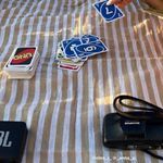 a table topped with lots of stickers on top of a striped cloth covered table